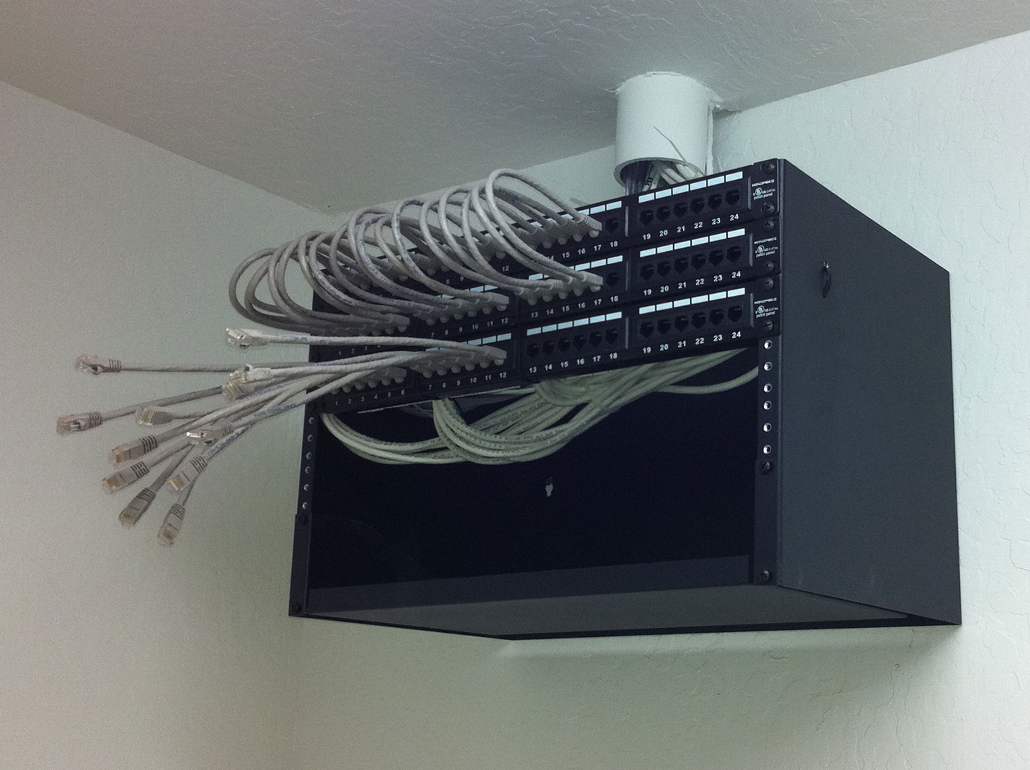 box electrical box hanging in corner of ceiling